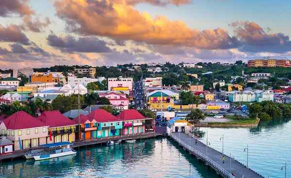 BUS-MARI-VERG St  John s  Antigua port and skyline at twilight shutterstock 550174645