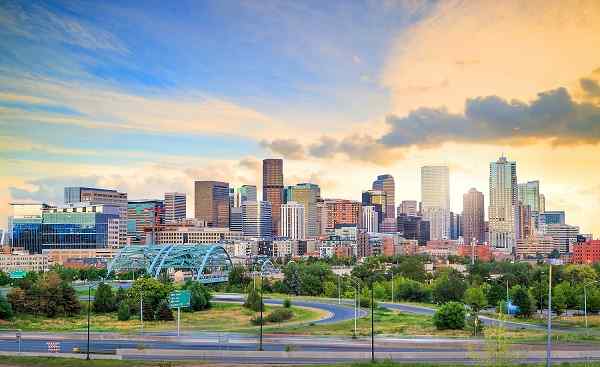 DENVER-BRONC Panorama of Denver skyline long exposure at twilight hutterstock 635414480