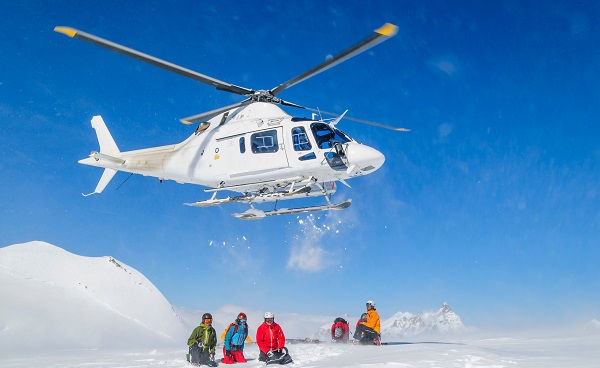 ISL-HELISKIING Heli-Skiing group with helicopter 1251561406