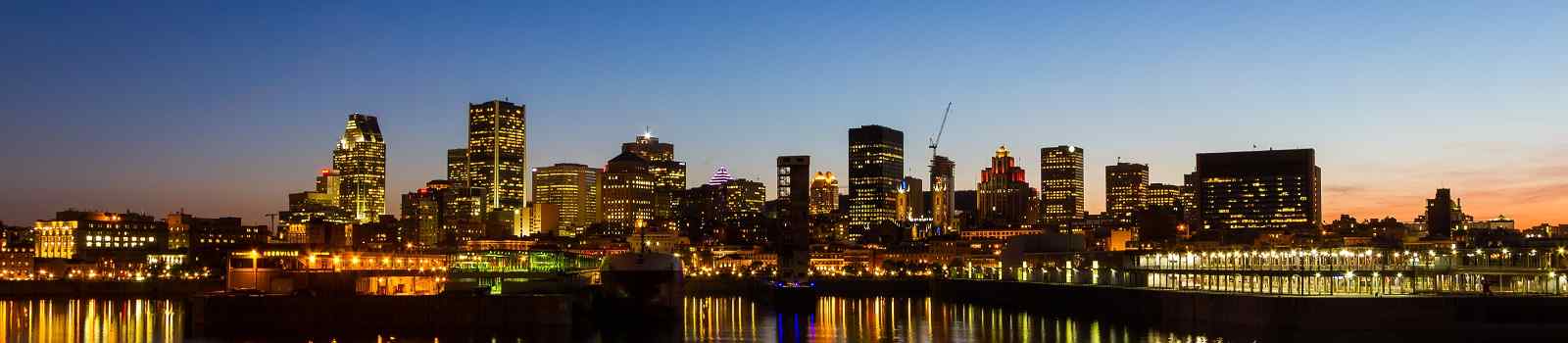 ROUTE-VOYAGEURS montreal quebec city skyline at night shutterstock 142337923