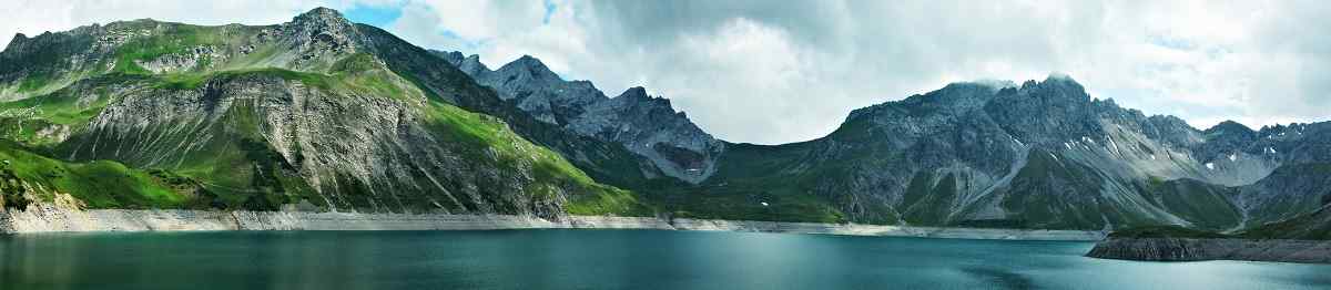 SLIDER Austrian Alps-panoramic view of the lake Lunersee and mountains Ratikon 733604554