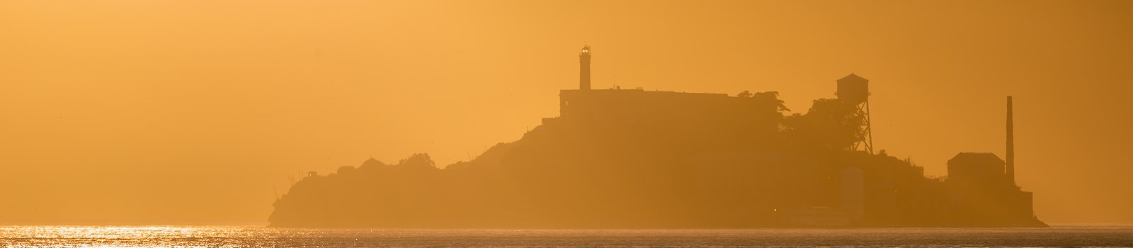 -San Francisco Alcatraz island penitentiary at sunset backlight 173285675